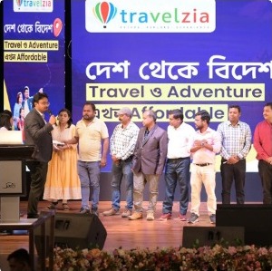 Travelzia team on stage at the Desh Theke Bidesh event